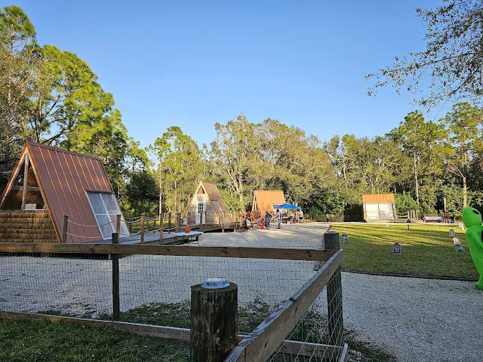Row of A-frame cabins along the glamp village path