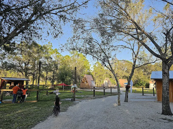 Gravel path winding through the glamp village